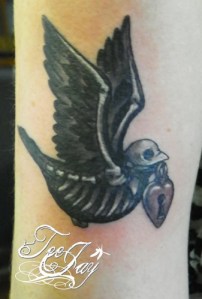 Skeleton Sparrow with locket tattoo