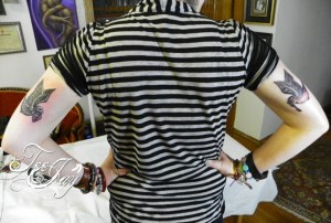 Sparrow tattoos on back of arm