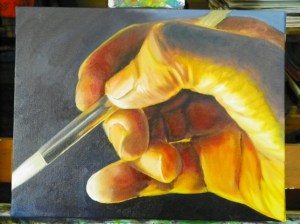 oil painting hand with paintbrush