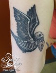 dead traditional bird tattoo