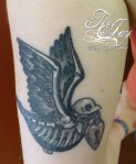 dead traditional bird tattoo