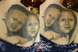 black and grey portrait tattoo