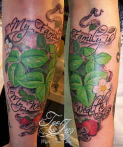 family wealth strawberry tattoo