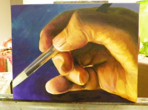 oil painting hand with paintbrush