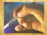 hand with brush oil painting