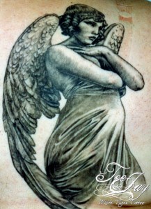 angel sculpture tattoo