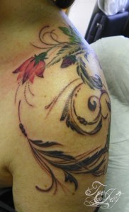 feminine shoulder swirl tattoo