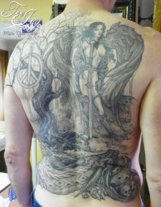 black and grey back tattoo