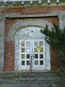 door of abandoned high school