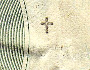 small cross stamp on currency