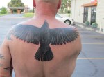 crow tattoo - finished (smoke break before photos and bandaging)