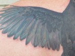 crow tattoo wing detail