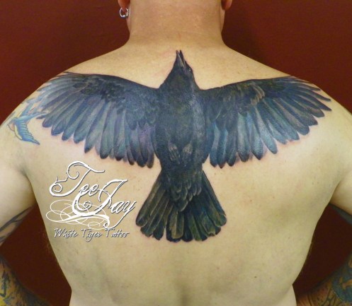 Full color crow tattoo