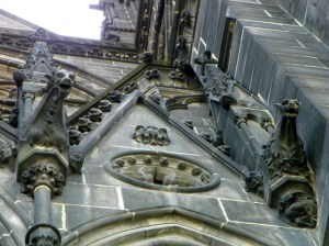 dudes and gargoyles on side of cathedral