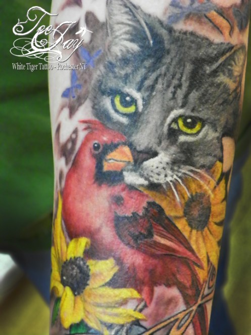 tattoo of cat and cardinal