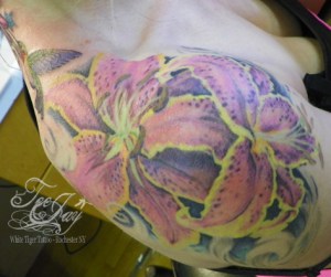 healed flowers tattoo on shoulder