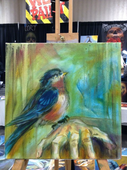 wip oil painting bird on hand