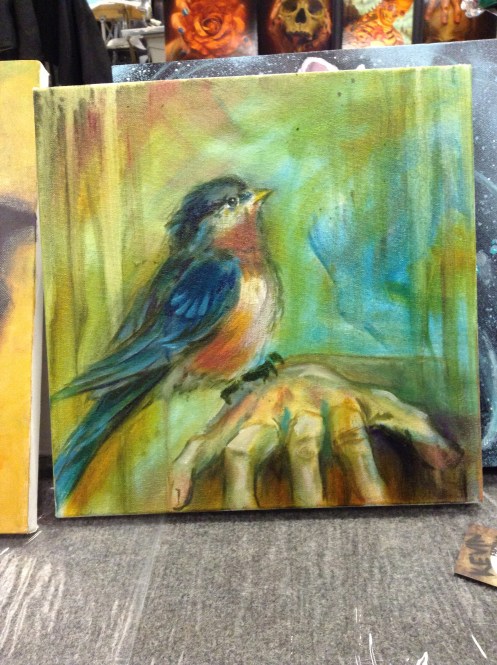 wip oil painting bird on hand