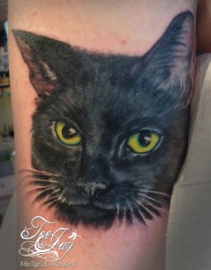 black cat portrait tattoo