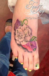 foot flowers tattoo