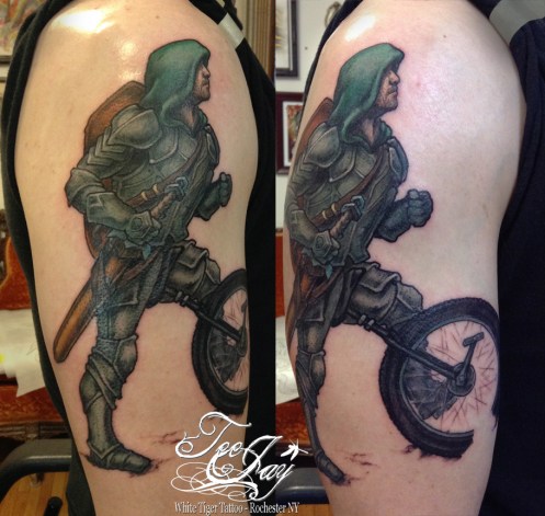 mountain unicycle knight tattoo