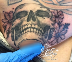 skull boob tattoo