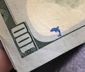 blue dolphin stamp on 100