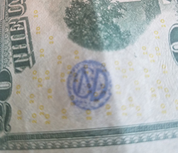CND monogram circle mark on 20 bill