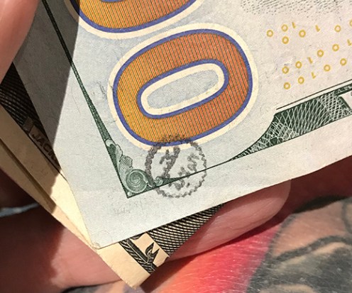 stamped $100 bill