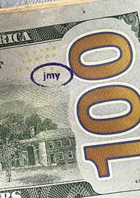 jmy stamp on $100 bill