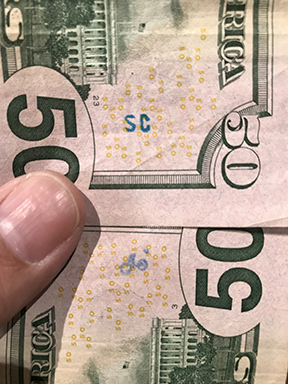 SC stamp on 50 dollar bill