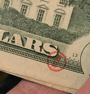 red round SDM stamp on $20