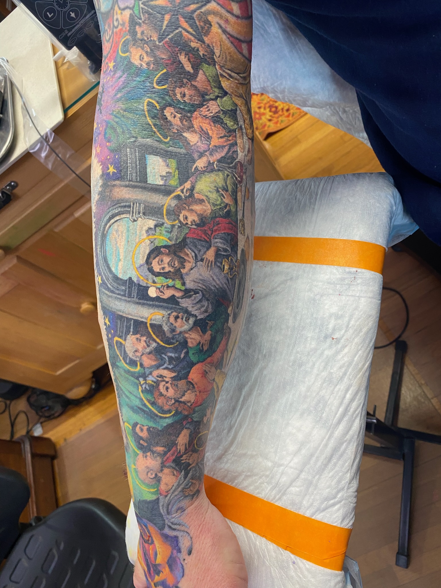 Last Supper tattoo healed on forearm